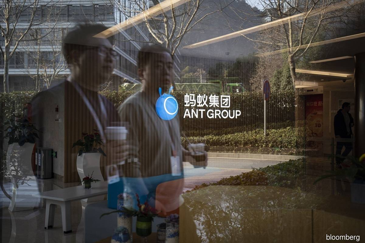 China vows oversight of fintech, financial holding firms